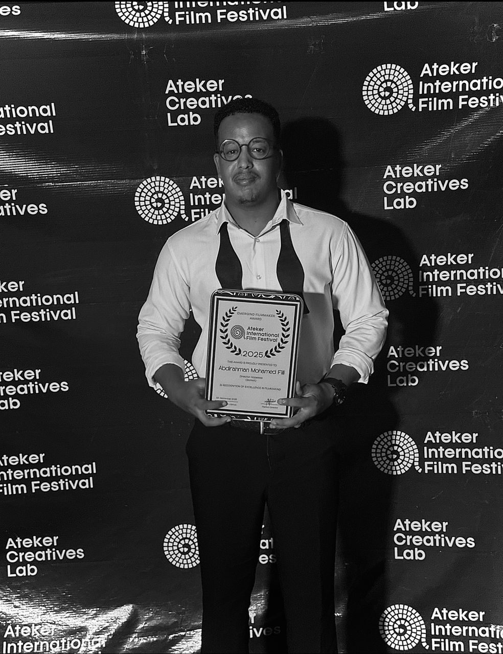 Abdirahman Fiili with the Emerging Filmmaker Award for Hopeless