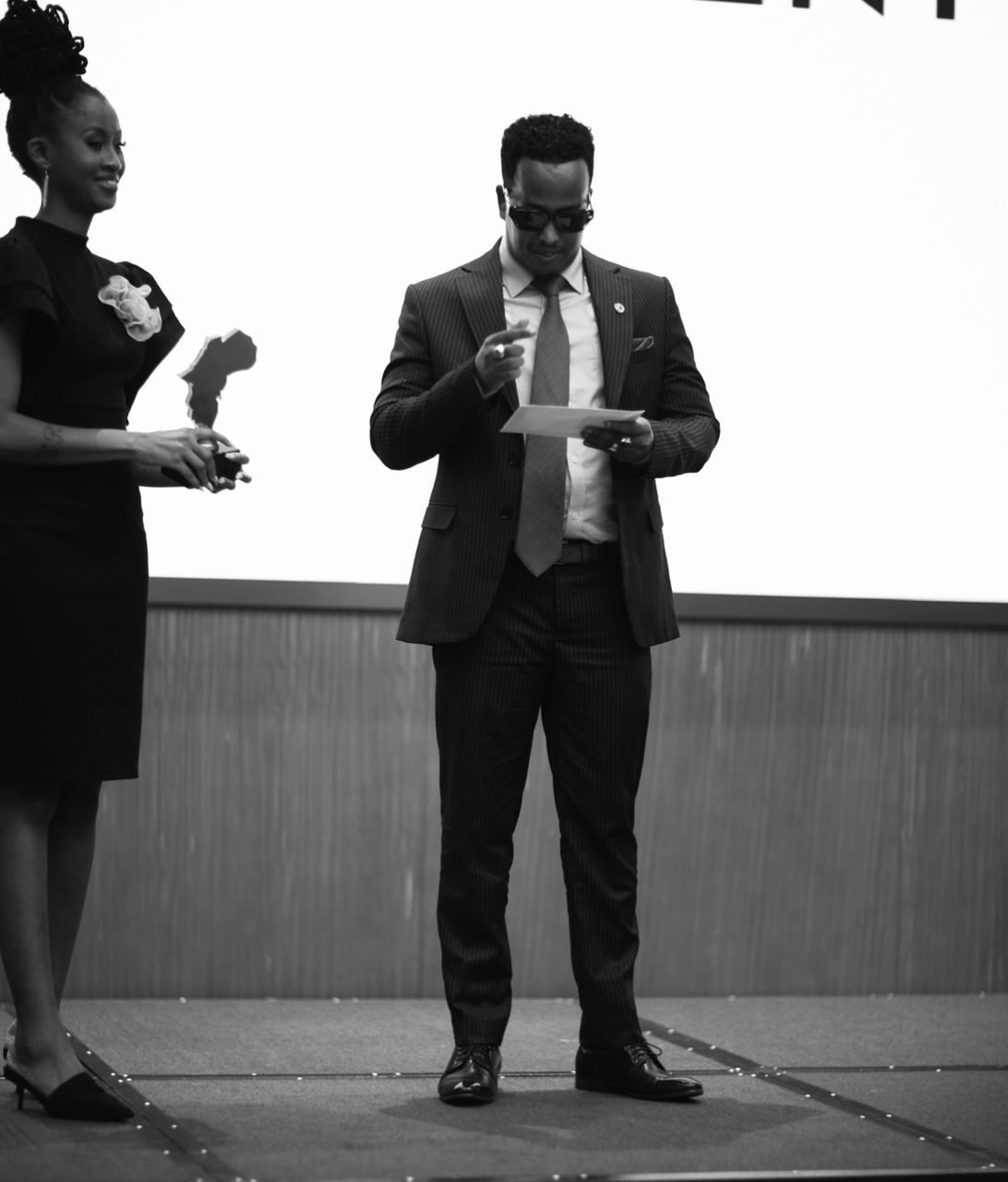 Abdirahman Fiili on stage at an awards ceremony